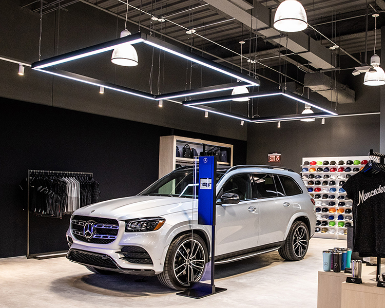 Pendant Linear LED lights used to illuminate a Mercedes retail space. Use our GlowbackLED LVLBP33 with RGBW DMX controlled for a fun and dynamic lighting look